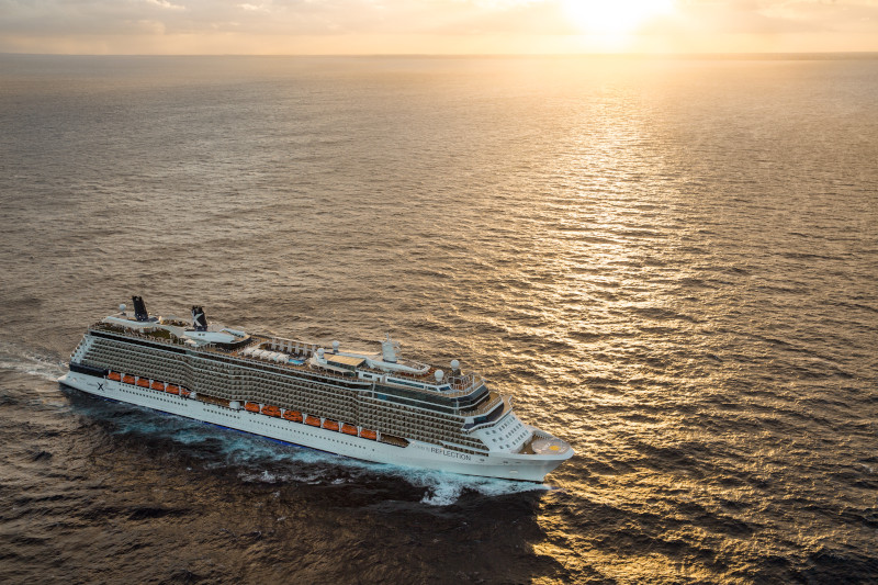 river vs ocean cruise. picture of a large cruise ship on the ocean as the sun sets