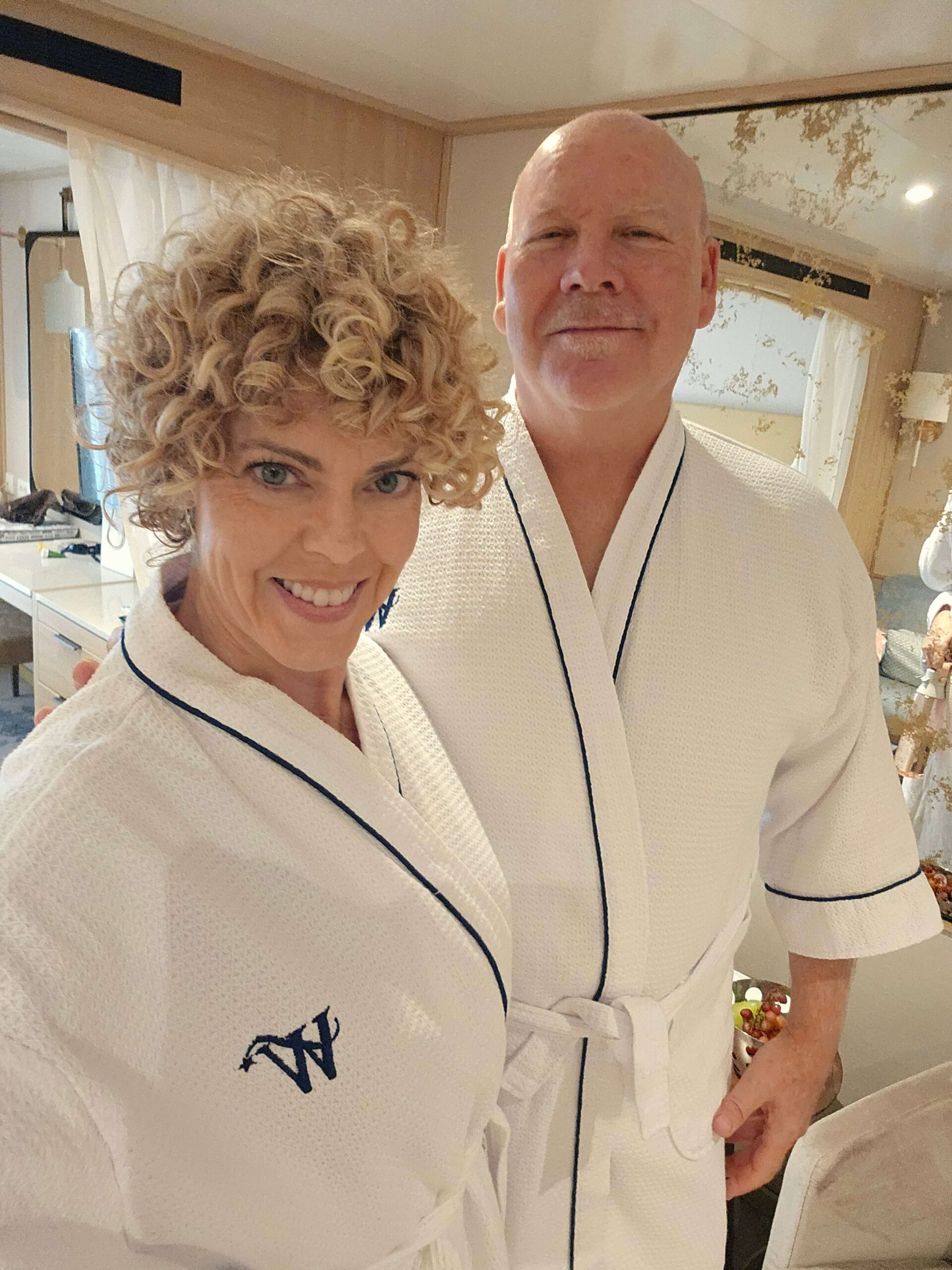 couple wearing robes on a Windstar cruise in blog post, best cruise for a honeymoon