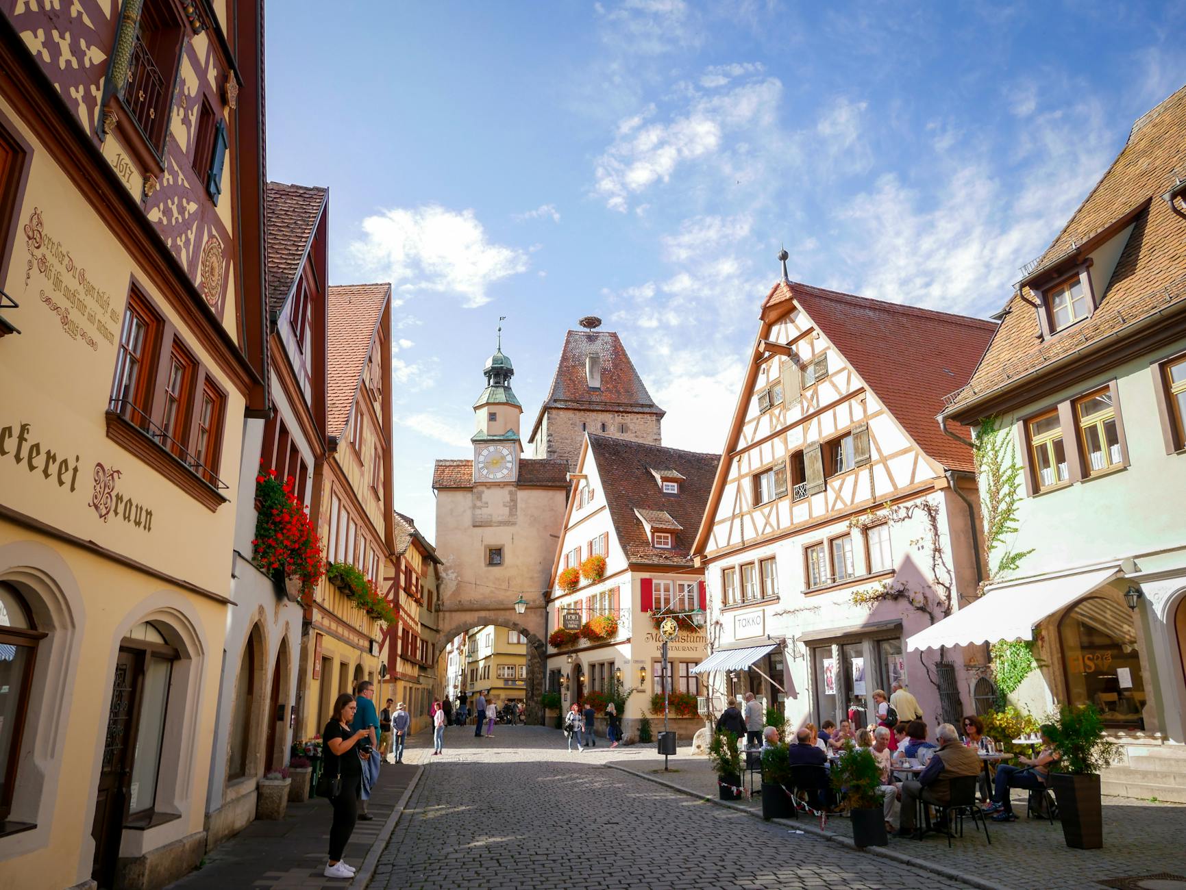 photo of buildings during daytime in European village; in post River