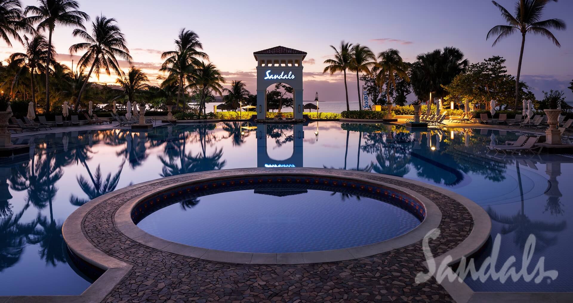 Sandals pool lit up at night from blog Sandals South coast honest review