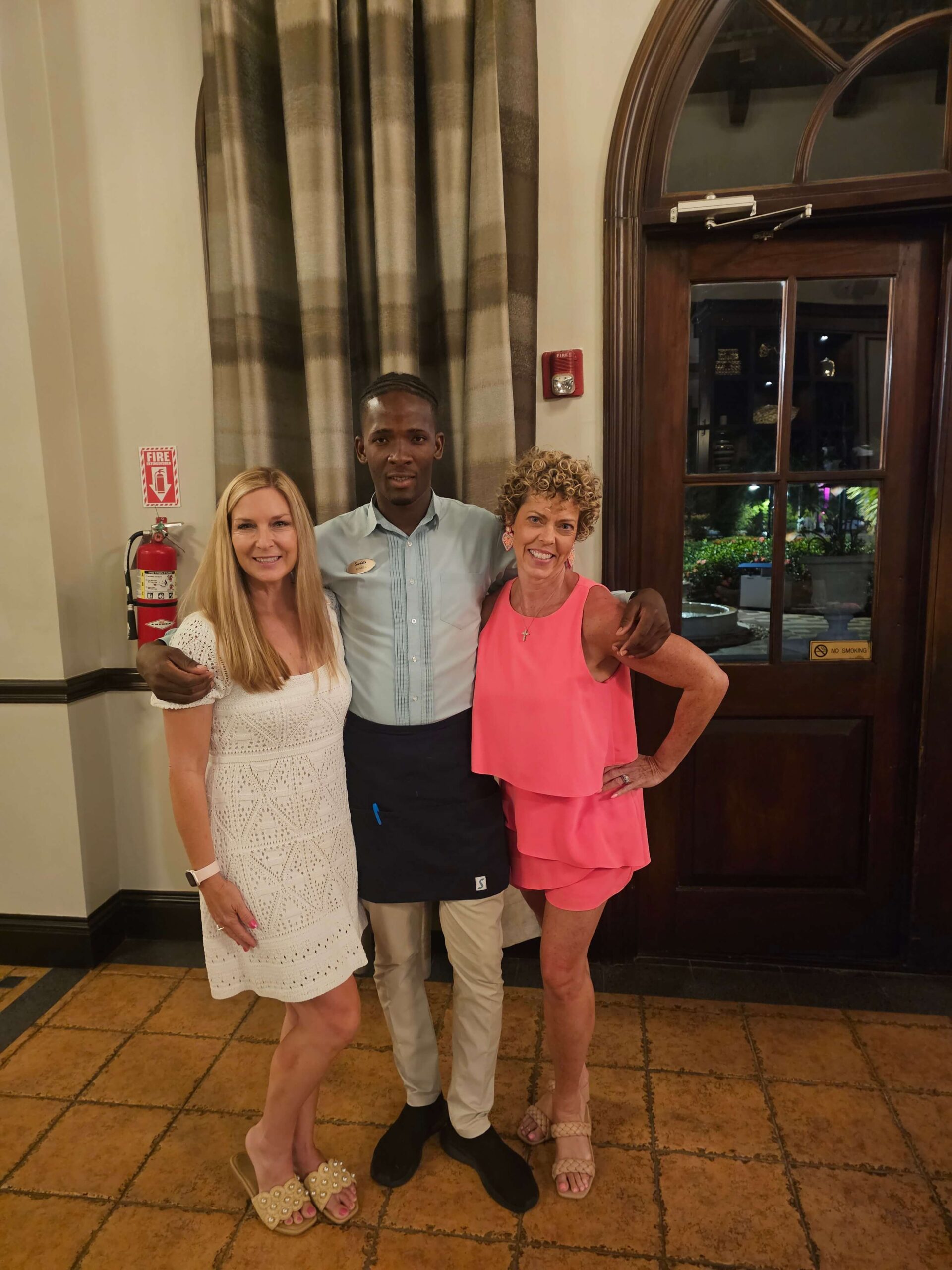 3 people hugging at restaurant from blog Sandals south coast