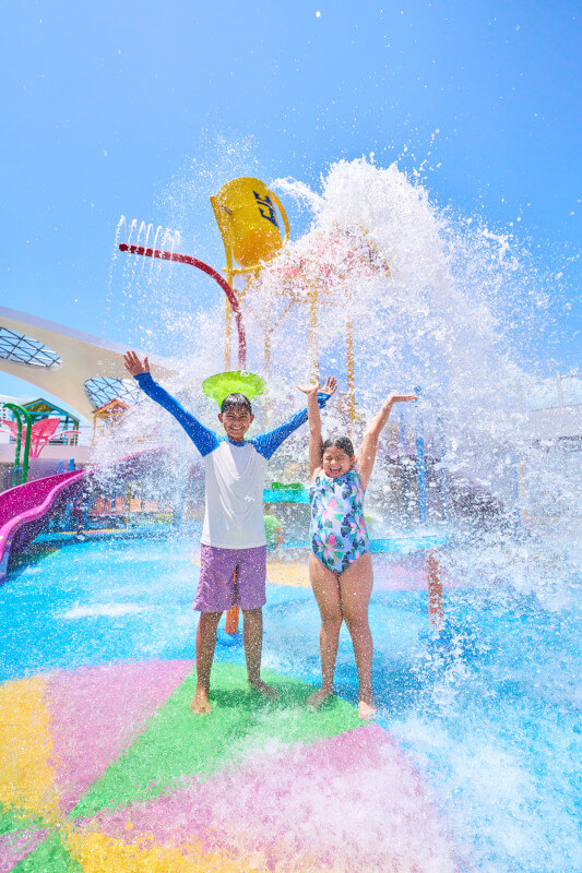kids getting splashed with water on a cruise ship; from blog Utopia of the Seas review