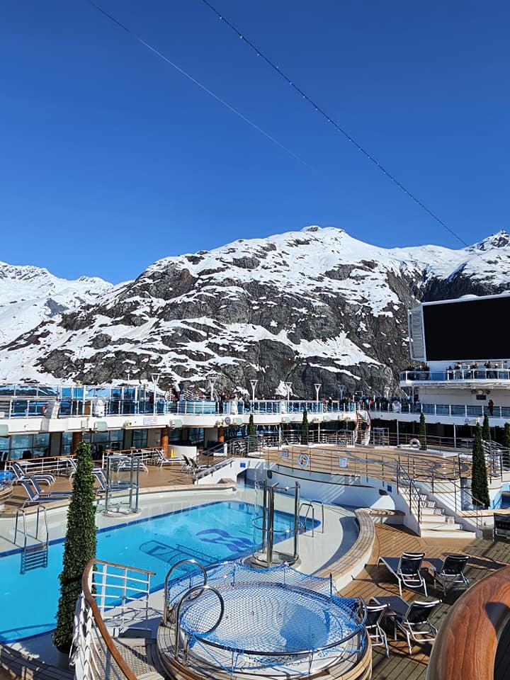 cruise ship deck and pool overlooking a glacier from blog Alaska cruise guide
