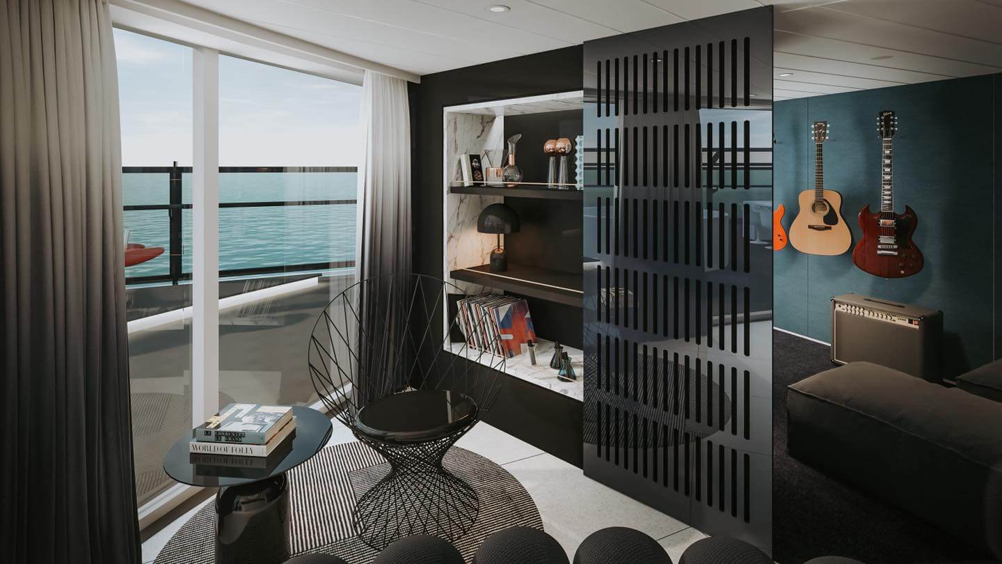 suite on cruise ship with sofa and a partition with guitars on the wall.  From blog post Celebrity cruses vs Virgin Voyages 