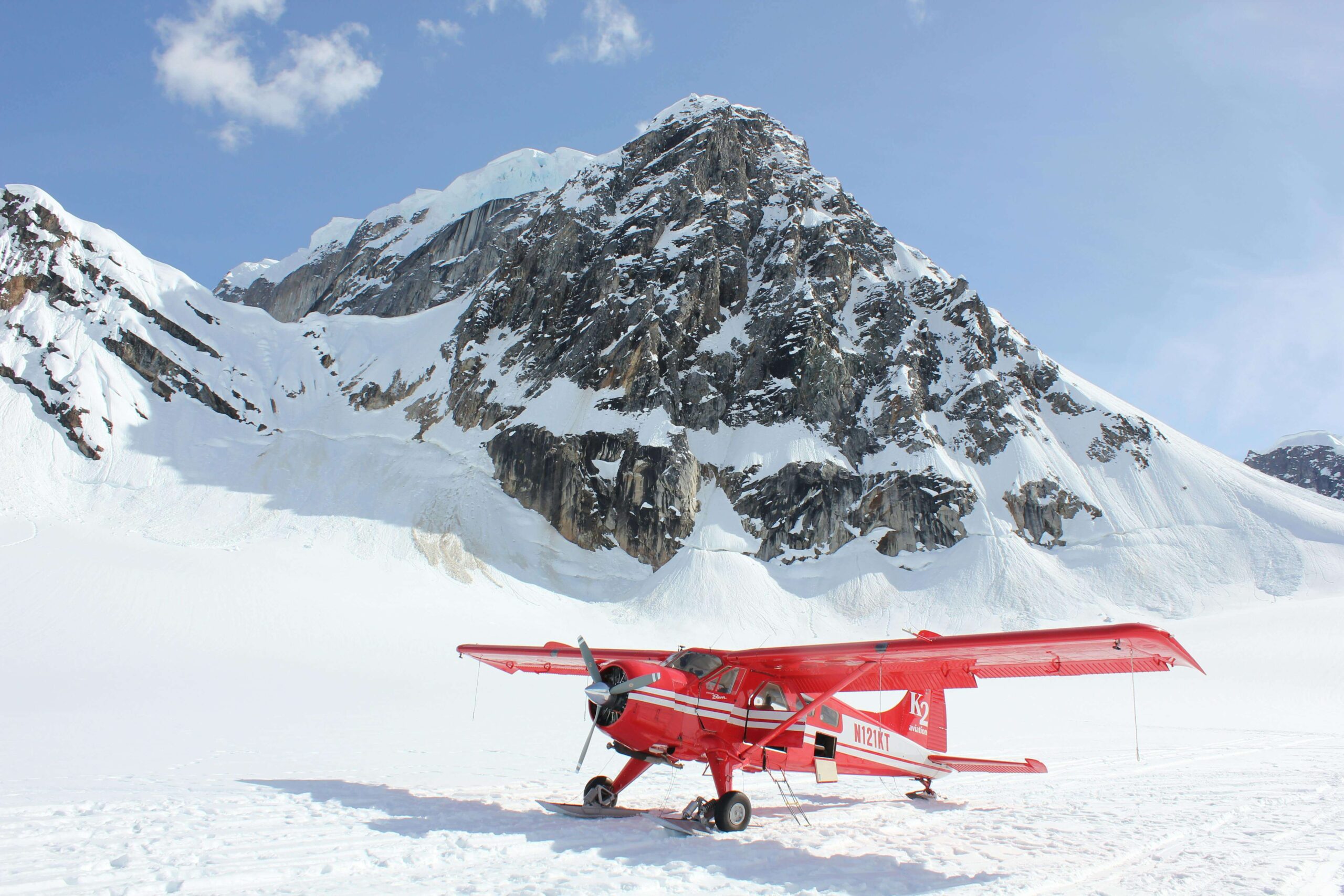 mountain and glacier with a plane landing on the glacier from  blog post: Alaska cruise guide
