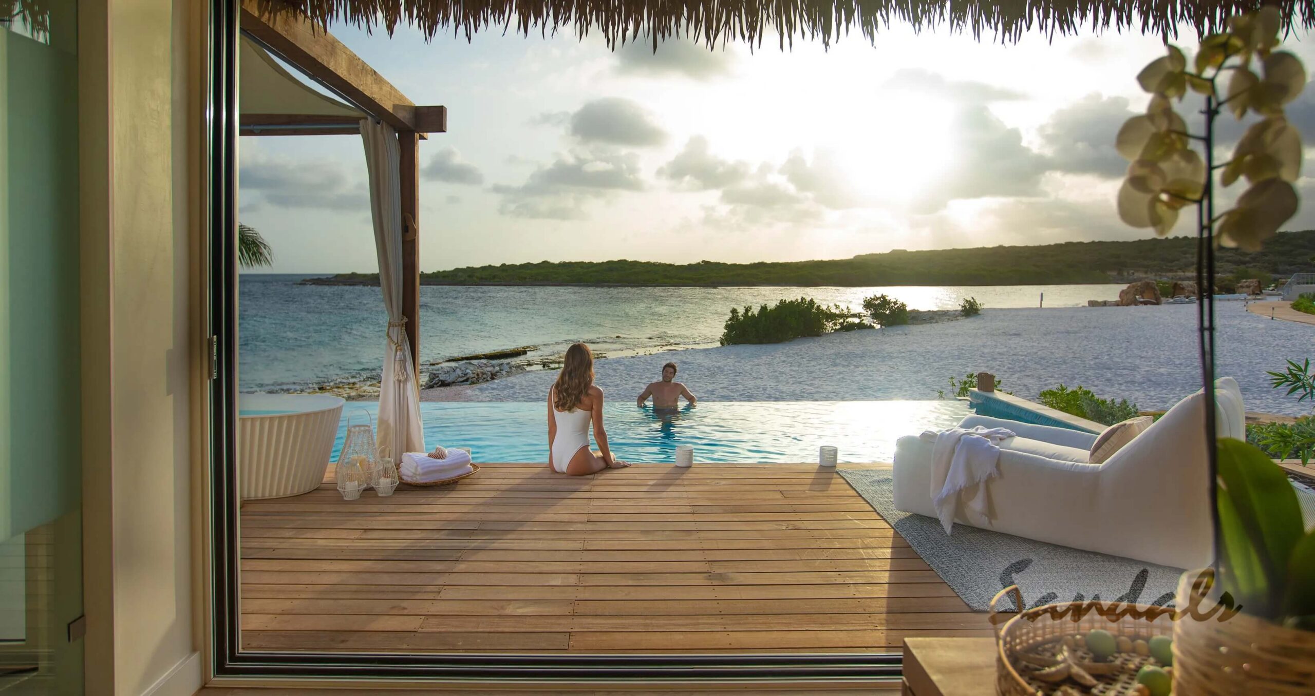 couple in private pool on beach
