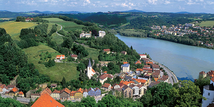 overhead view of a small german town with the river and mountains from blog post, shorter river cruises in Europe