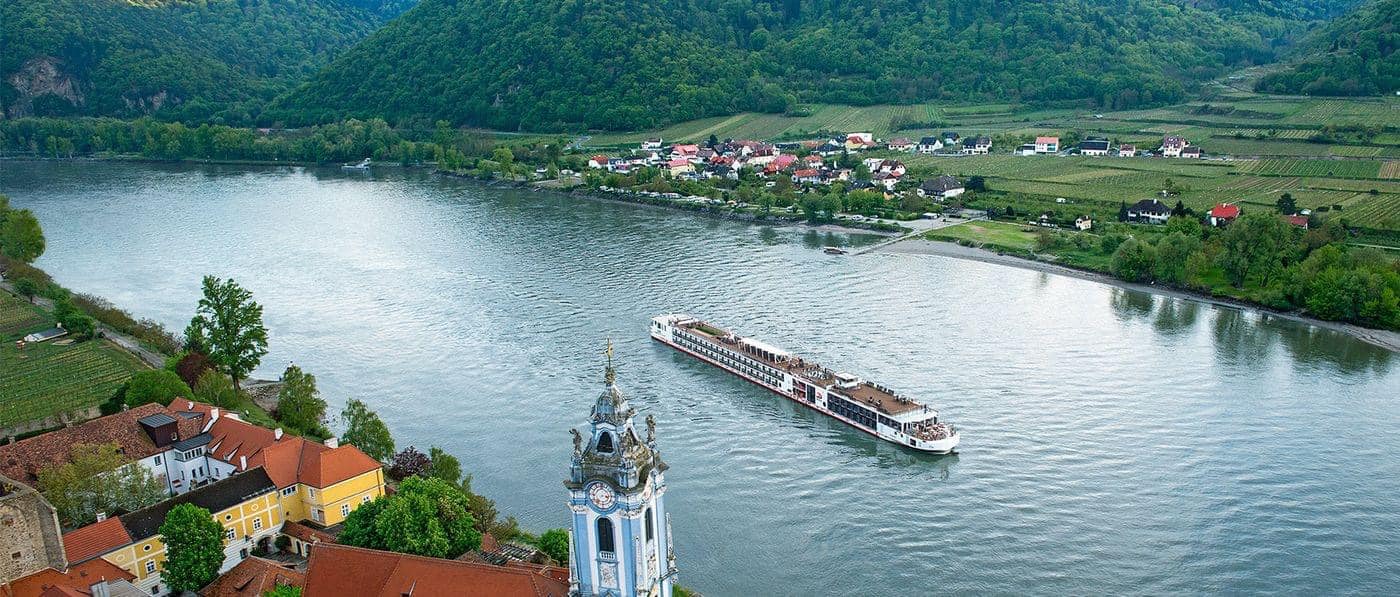 rivers of europe with a river cruise ship saiiling through